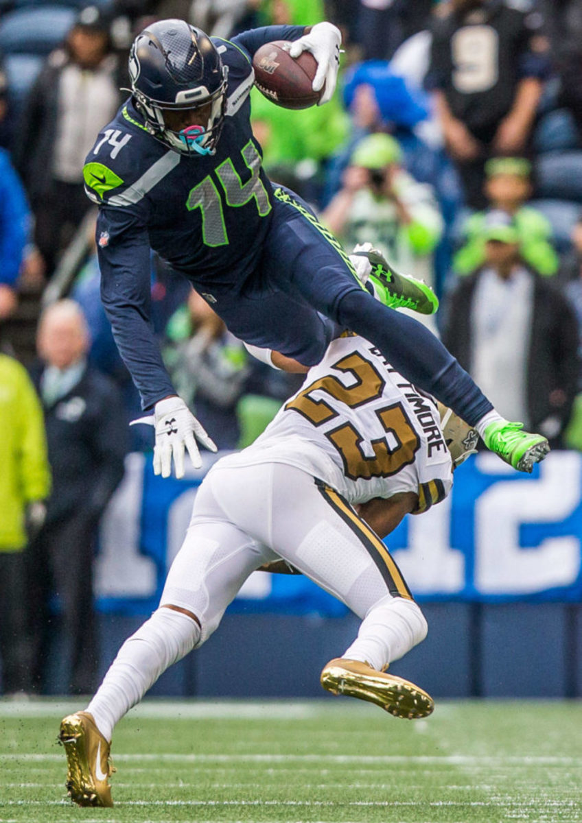 Saints CB Marshon Lattimore (23) takes down Seahawks WR DK Metcalf (14) after a short reception. Credit: Everett Herald